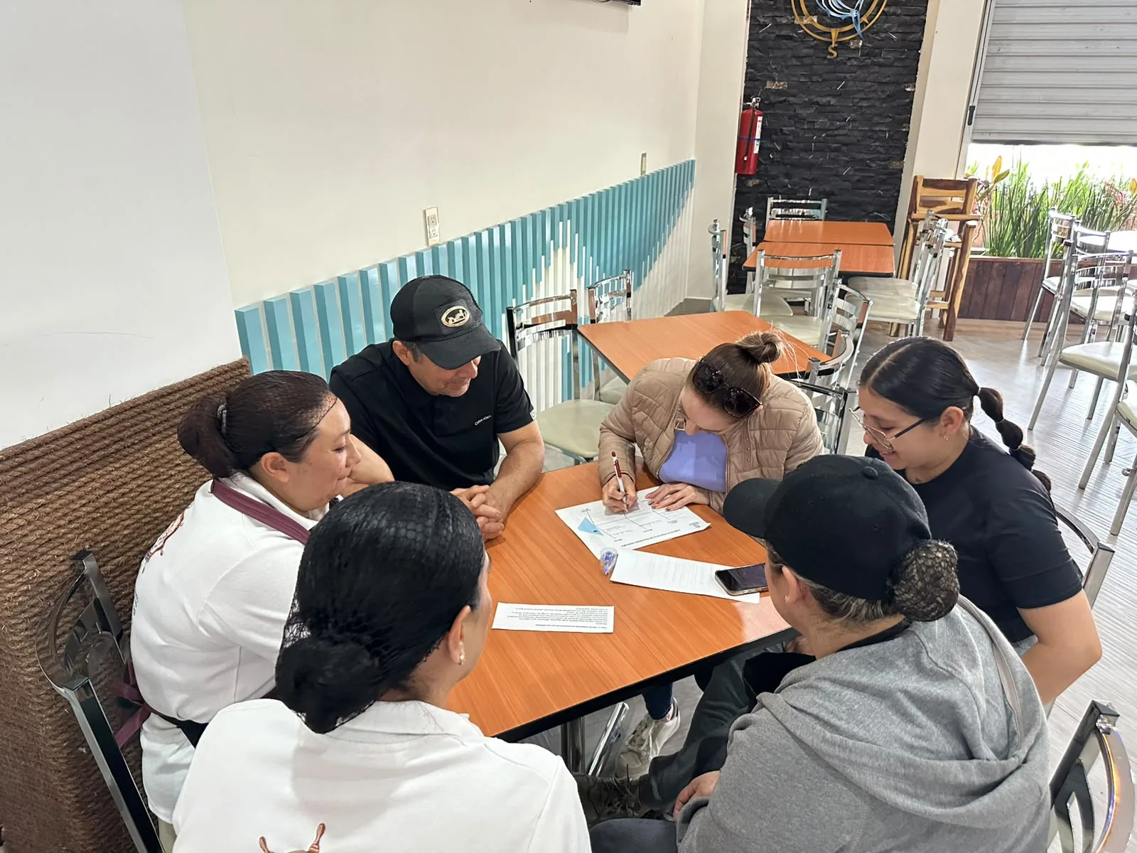 Trabajo en equipo durante capacitación QSC